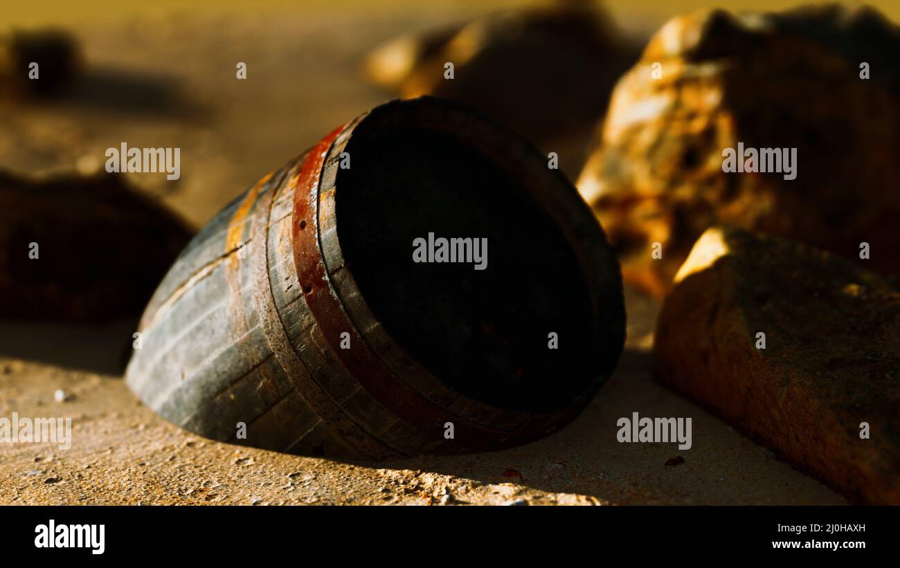 Old wooden barrel at sand beach Stock Photo