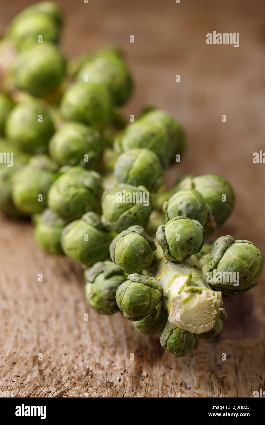Brussels sprouts on dark wood Stock Photo