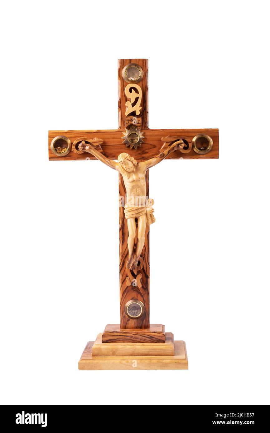 Wooden crucifix standing isolated on white background. Stock Photo