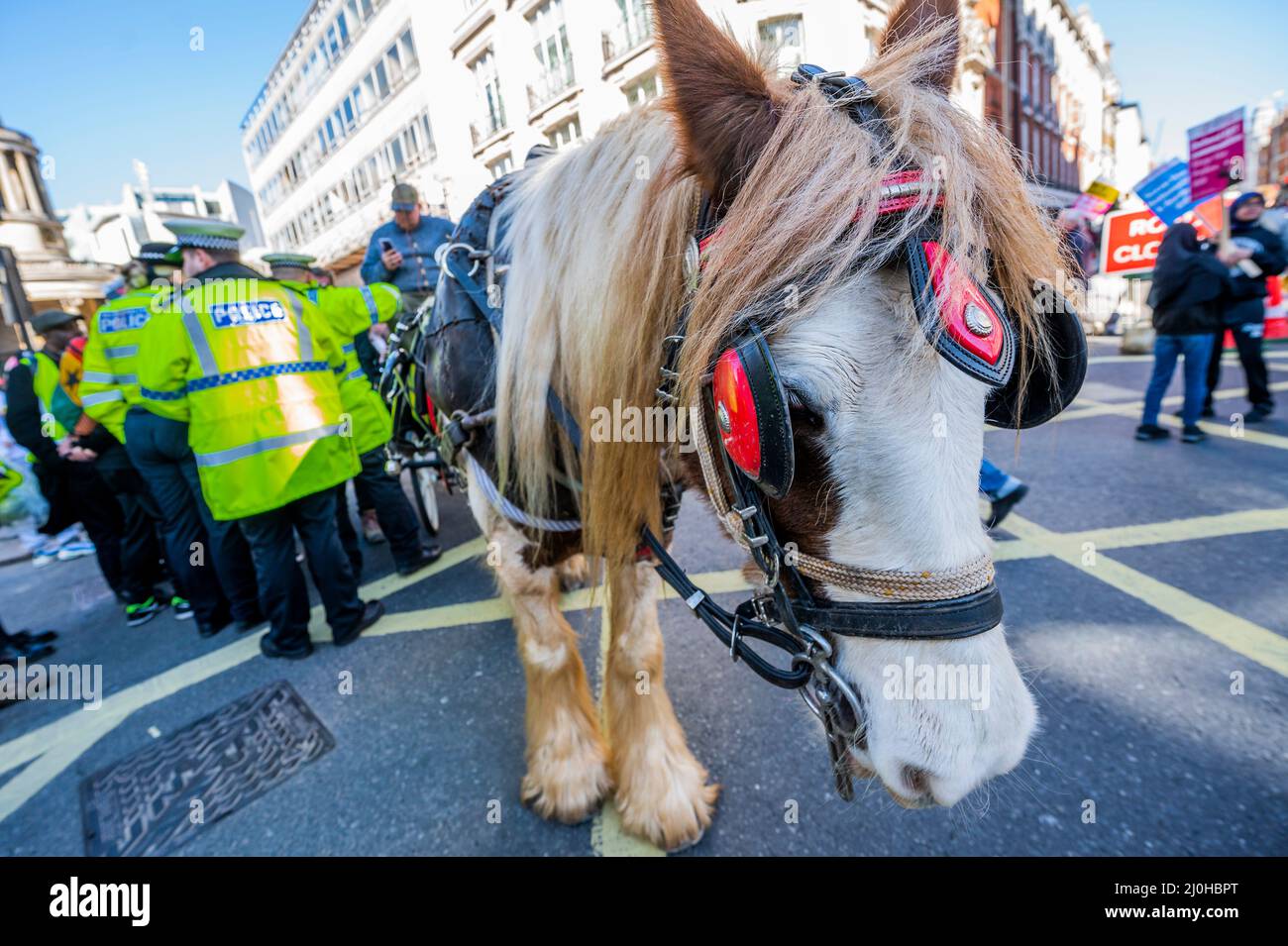London, UK. 19th Mar, 2022. Roma travellers with their horses and carriages join the protest, but are eventually asked to move on by the police, for fear that their horses may bolt because of teh police sirens - As part of a National demonstration a March Against Racism on UN Anti-Racism Day 2022. The march starts outside the BBC on Langham Place and was organised by Say No to Racism supported by several unions. Credit: Guy Bell/Alamy Live News Stock Photo