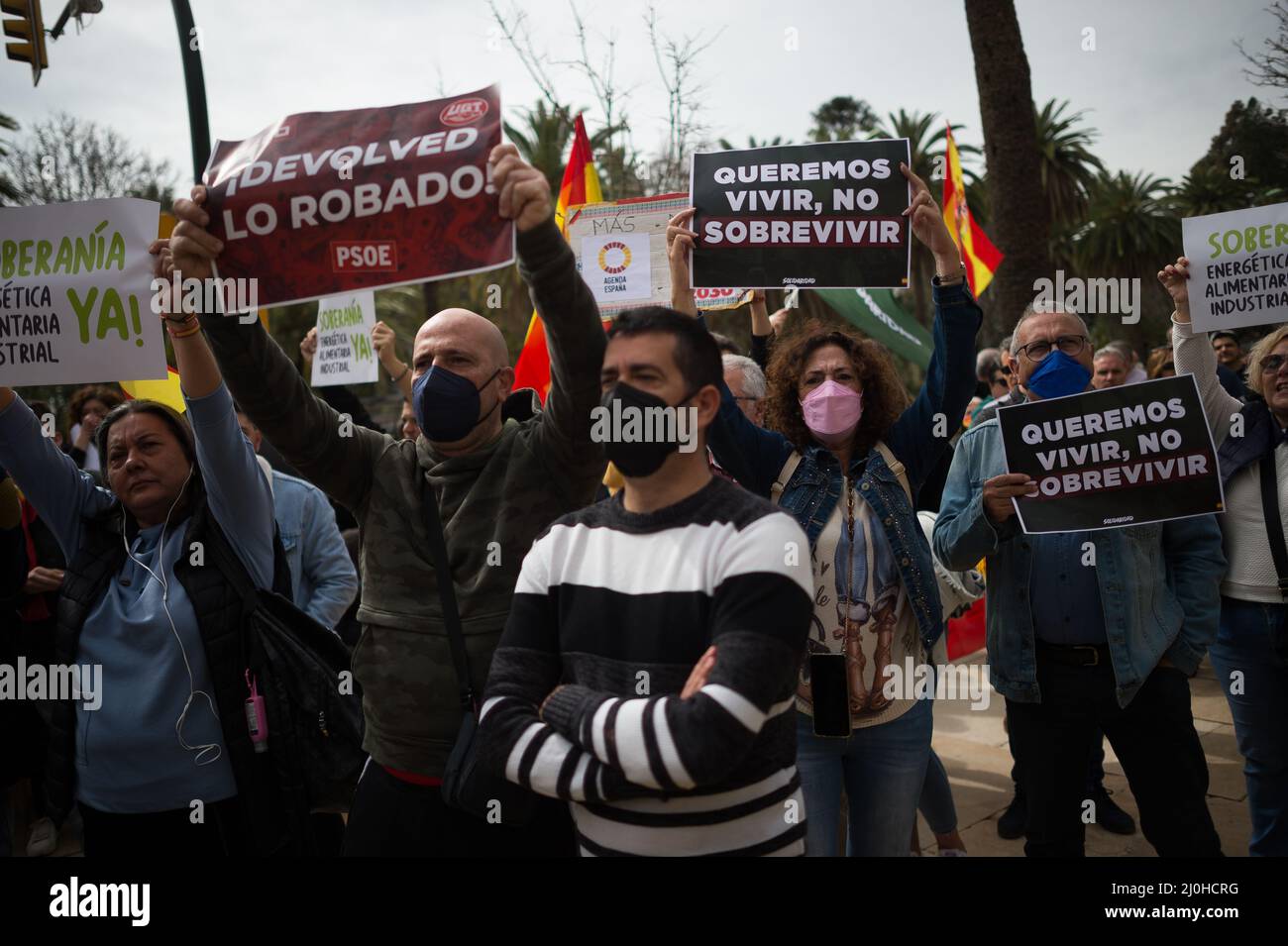 Supporters of far right Vox party are seen holding placards as they take part in a protest against rising fuel prices and Spanish government outside Malaga town hall. Spain experiences a general strike of truck drivers due to rise of prices in fuel and costs in other essential sectors causing discomfort between Spaniards and several protests in the country by political party VOX. The Spanish transport sector continues for sixth consecutive days in strike causing a shortage in some essential products in supermarkets. (Photo by Jesus Merida/SOPA Images/Sipa USA) Stock Photo