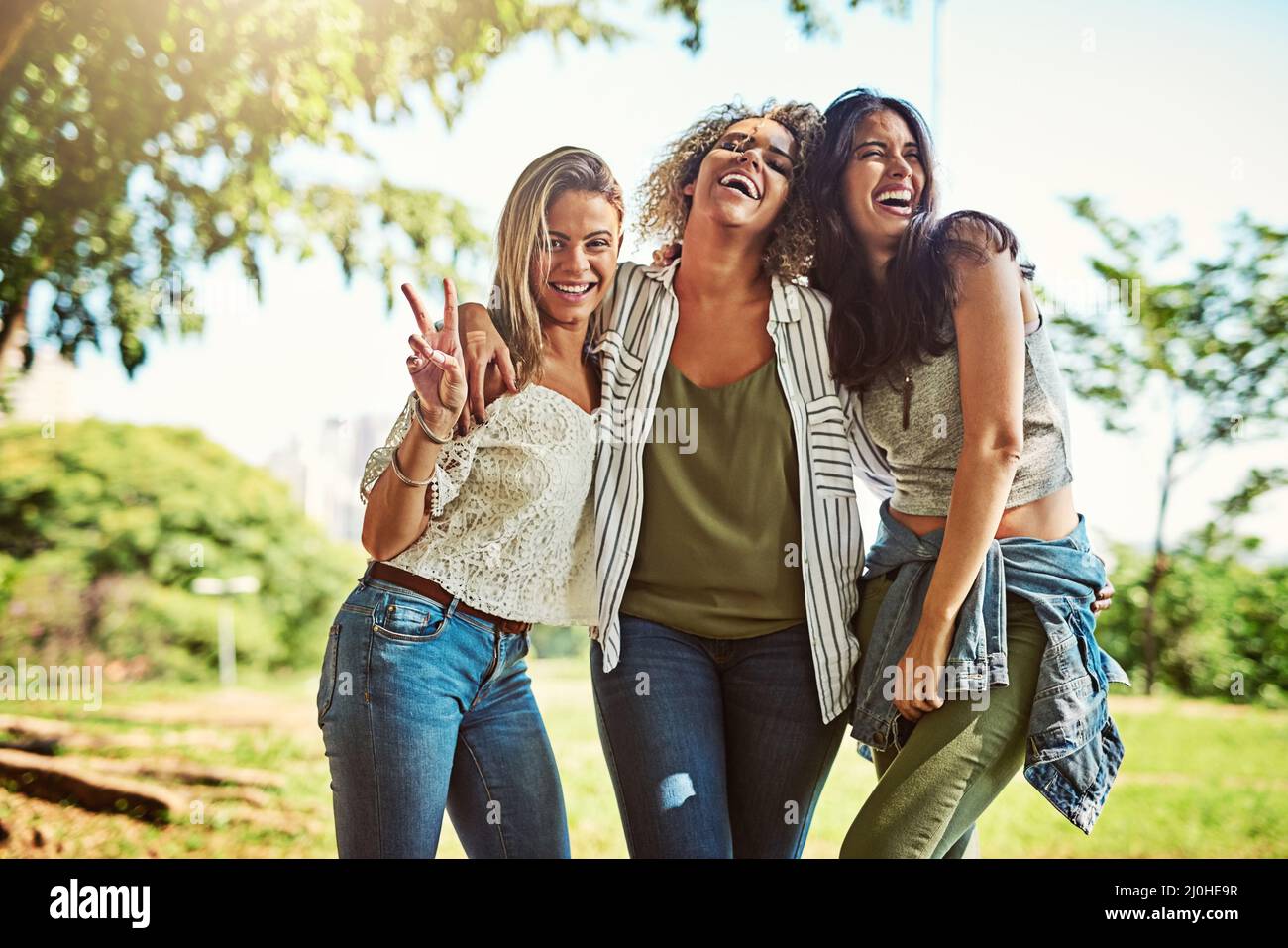 Girls day out has been such a blast. Portrait of a group of friends bonding together outdoors. Stock Photo