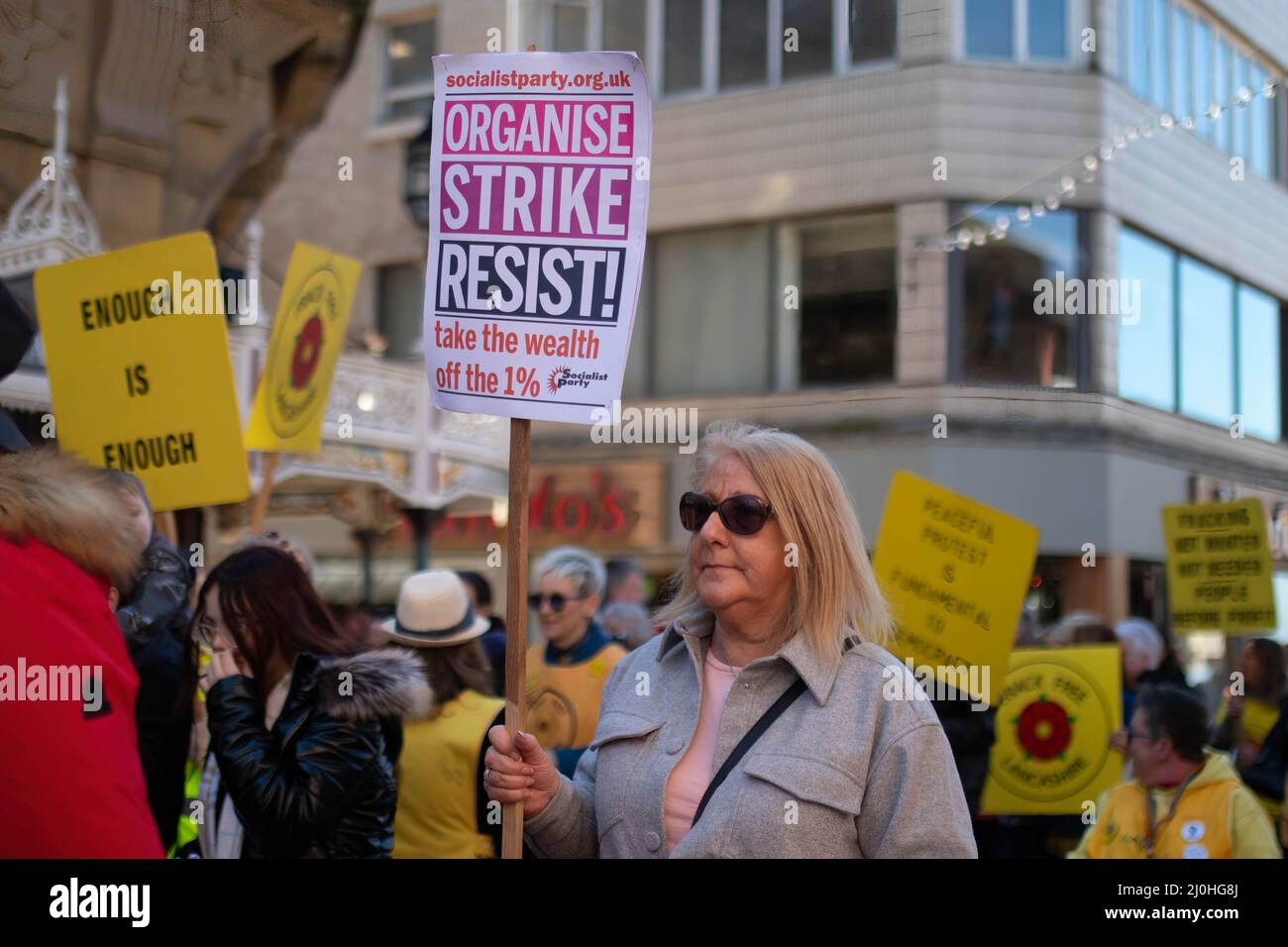 Blackpool, UK. 19th Mar, 2022. A woman holds a sign expressing her opinion during the demonstration. Protesters gathered outside the Winter Gardens where the Conservative Spring conference was taking place from to protest against many different issues from fracking to Police Sentencing and Crime Bill. Credit: SOPA Images Limited/Alamy Live News Stock Photo