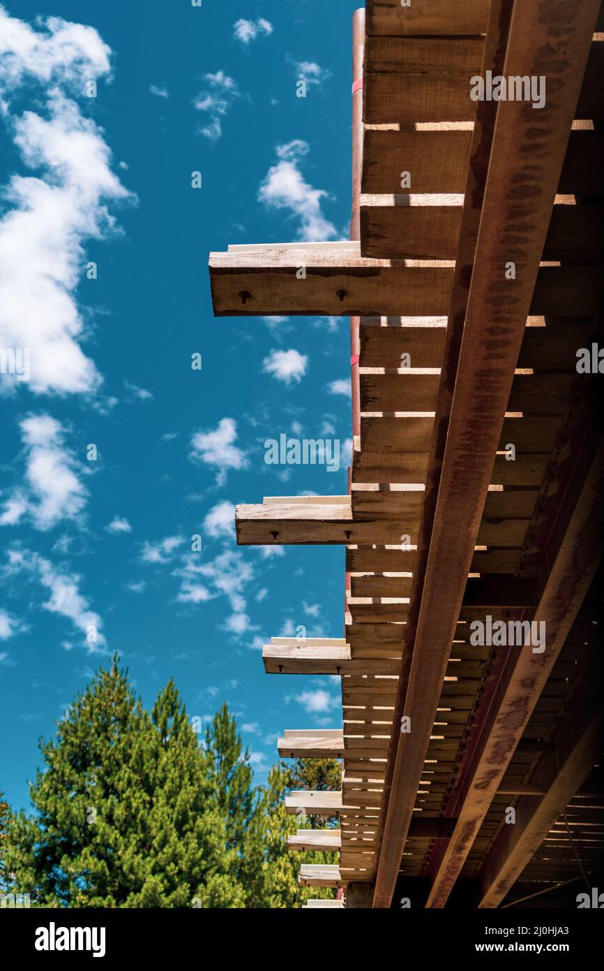 Vertical low angle shot of the roof of a wooden building against a ...