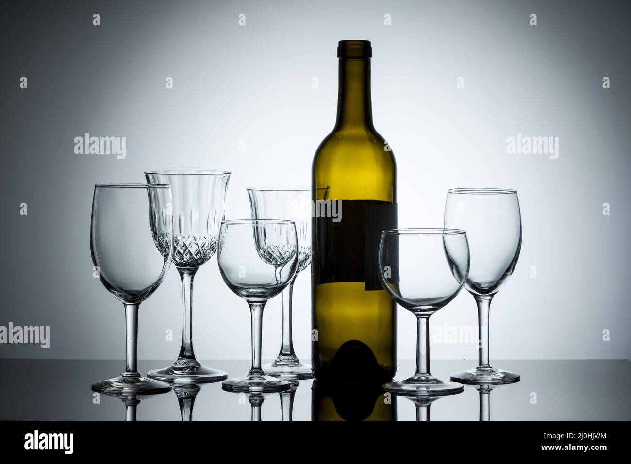 Various wine glasses with a bottle Stock Photo Alamy