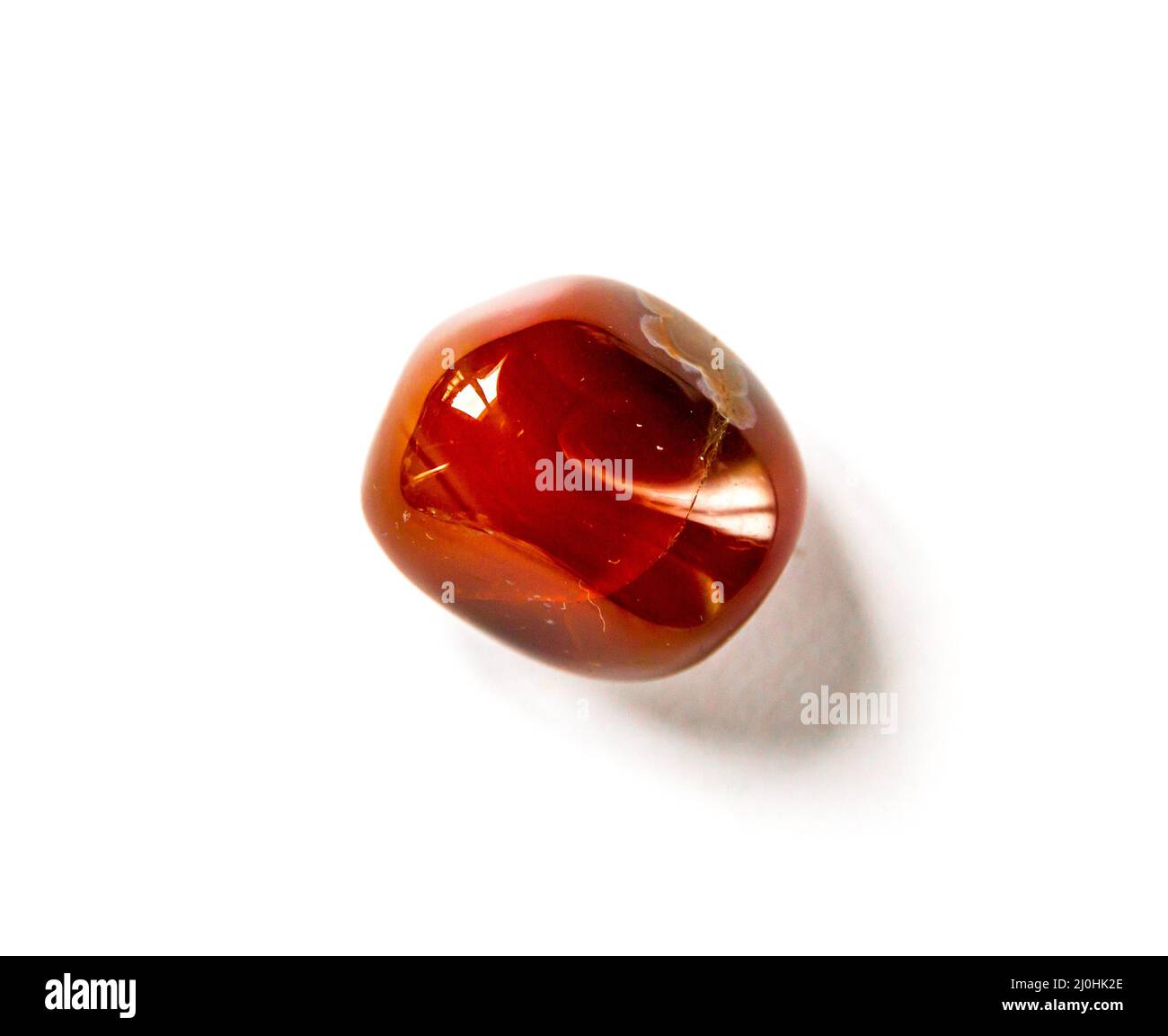 Carnelian agate gemstone on a white background Stock Photo