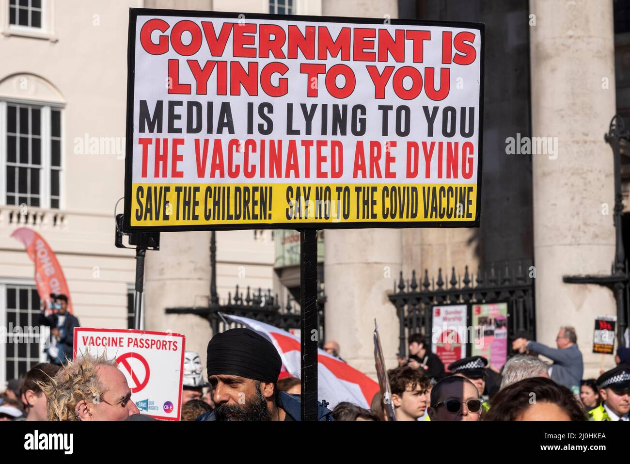 Westminster, London, UK. 19th Mar, 2022.A protest is taking place against vaccinating children for Covid 19, joined by anti-vaxxers. Placard stating government is lying, media is lying, vaccinated are dying Stock Photo