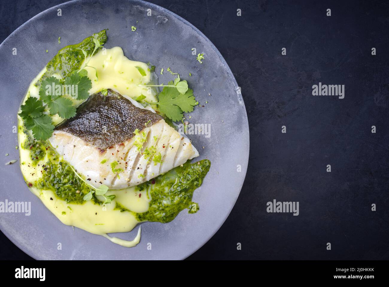 Modern style traditional fried skrei cod fish filet with mashed potato