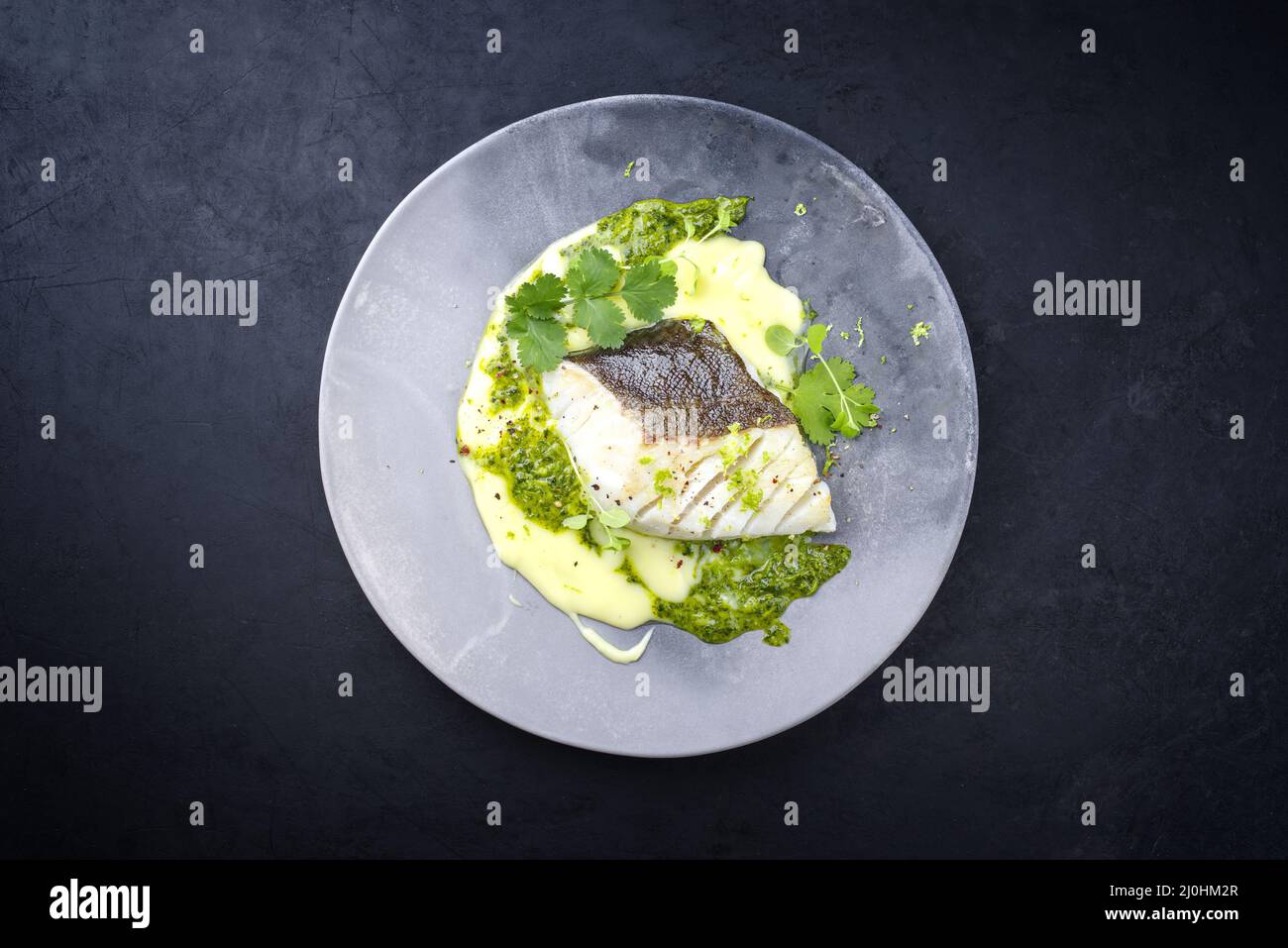 Modern style traditional fried skrei cod fish filet with mashed potato