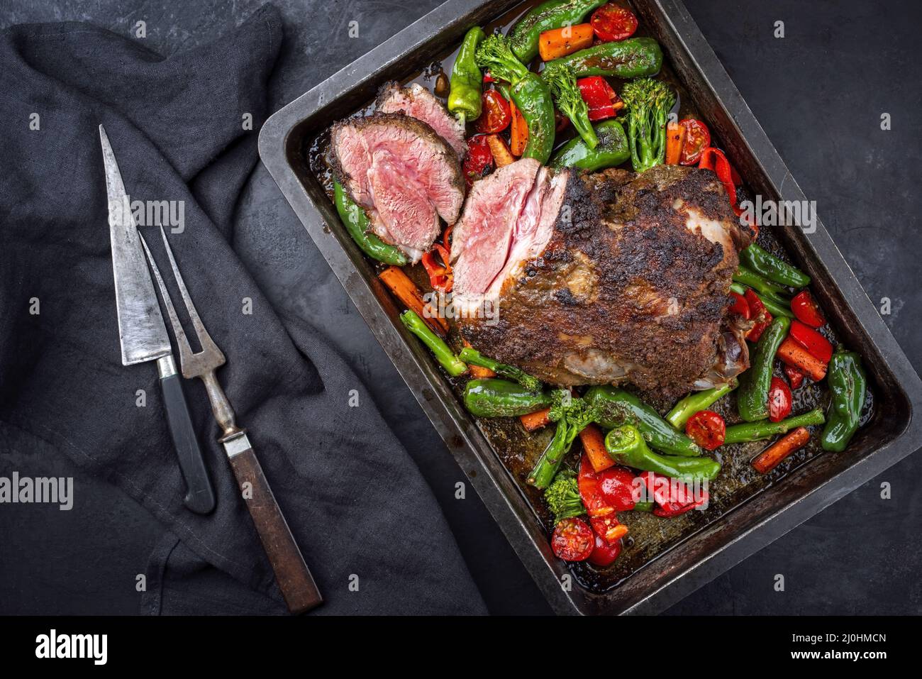 Traditional English barbecue lamb roast with vegetable and gravy sauce