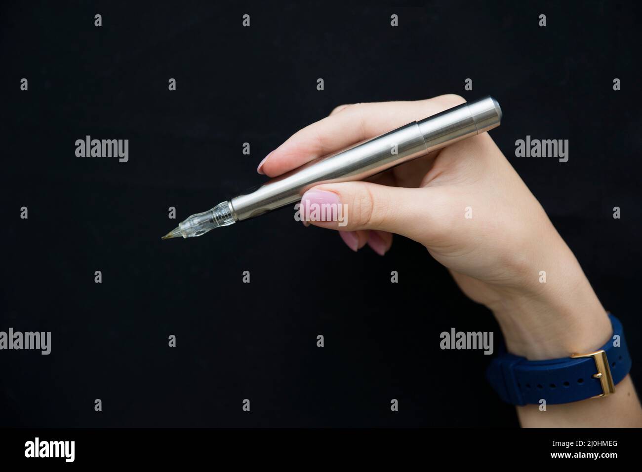 Silver microblading pen for eyebrow on black background Stock Photo