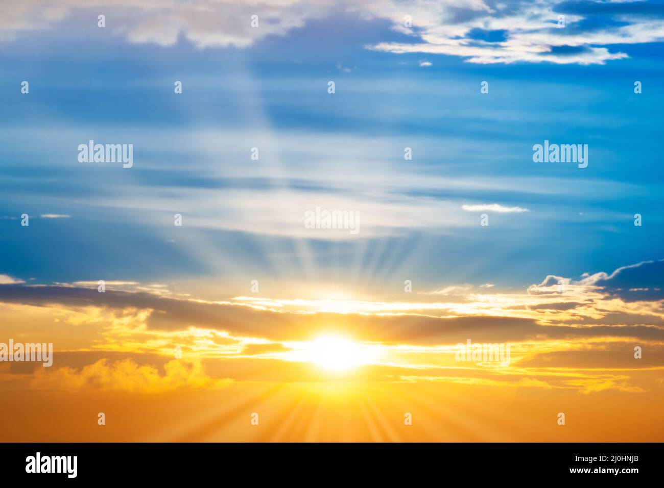 Sunset sky with sun rays Stock Photo