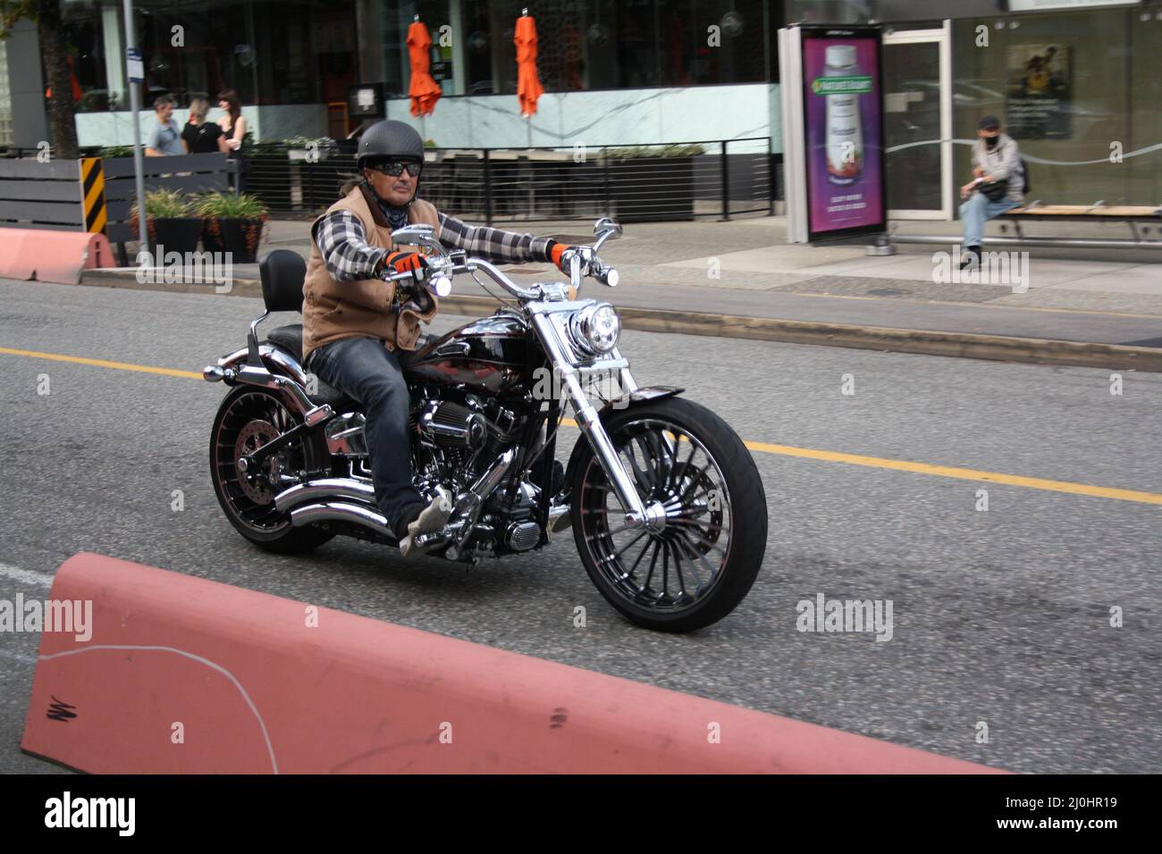 Man riding a motorcycle in downtown Vancouver, British Columbia, Canada Stock Photo Alamy