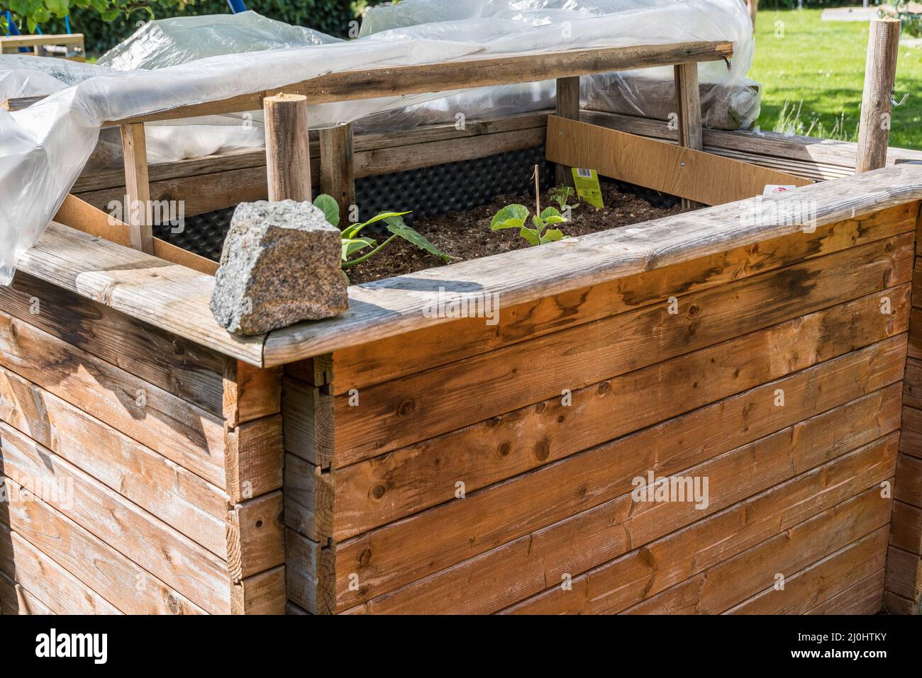 Planted raised bed in spring - self-made cold frame Stock Photo