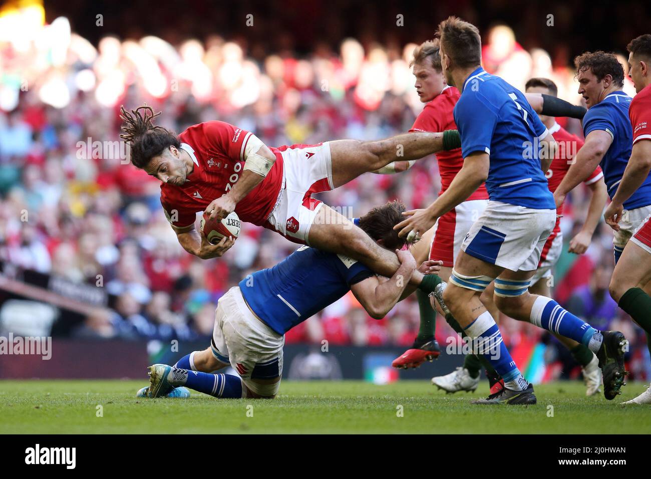 Cardiff, UK. 19th Mar, 2022. Josh Navidi of Wales is tackled. Guinness Six Nations championship 2022 match, Wales v Italy at the Principality Stadium in Cardiff on Saturday 19th March 2022. pic by Andrew Orchard/Andrew Orchard sports photography/ Alamy Live News Credit: Andrew Orchard sports photography/Alamy Live News Stock Photo