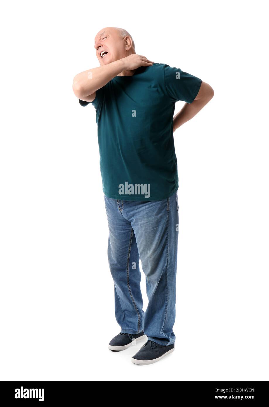 Senior man suffering from back pain on white background Stock Photo - Alamy