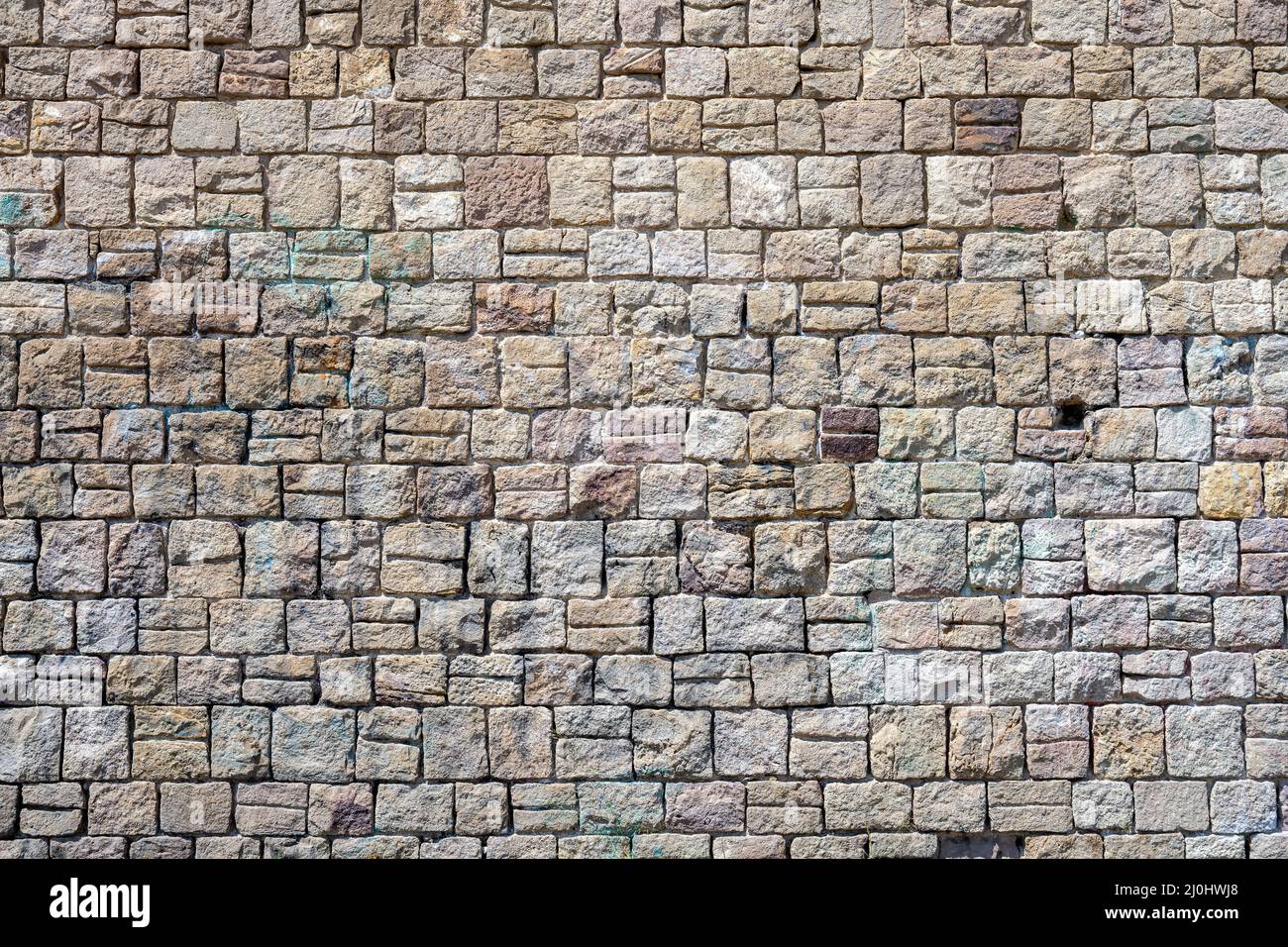 Background from a beautiful natural old stone wall Stock Photo