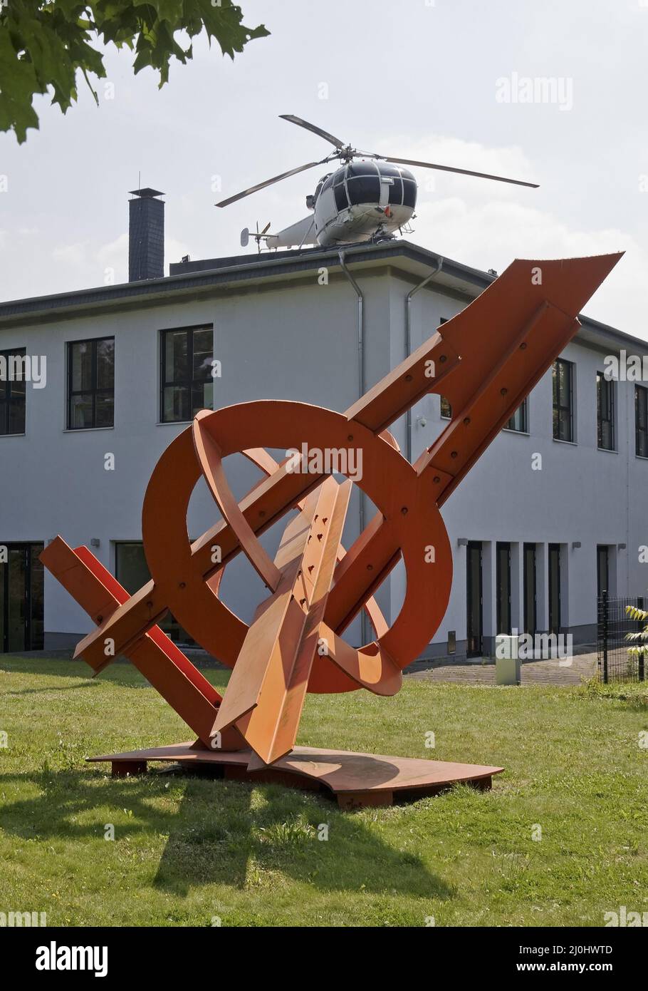 Artwork by Mark di Suvero in front and the helicopter by Michael Sailstorfer, sculpture park Cologne Stock Photo
