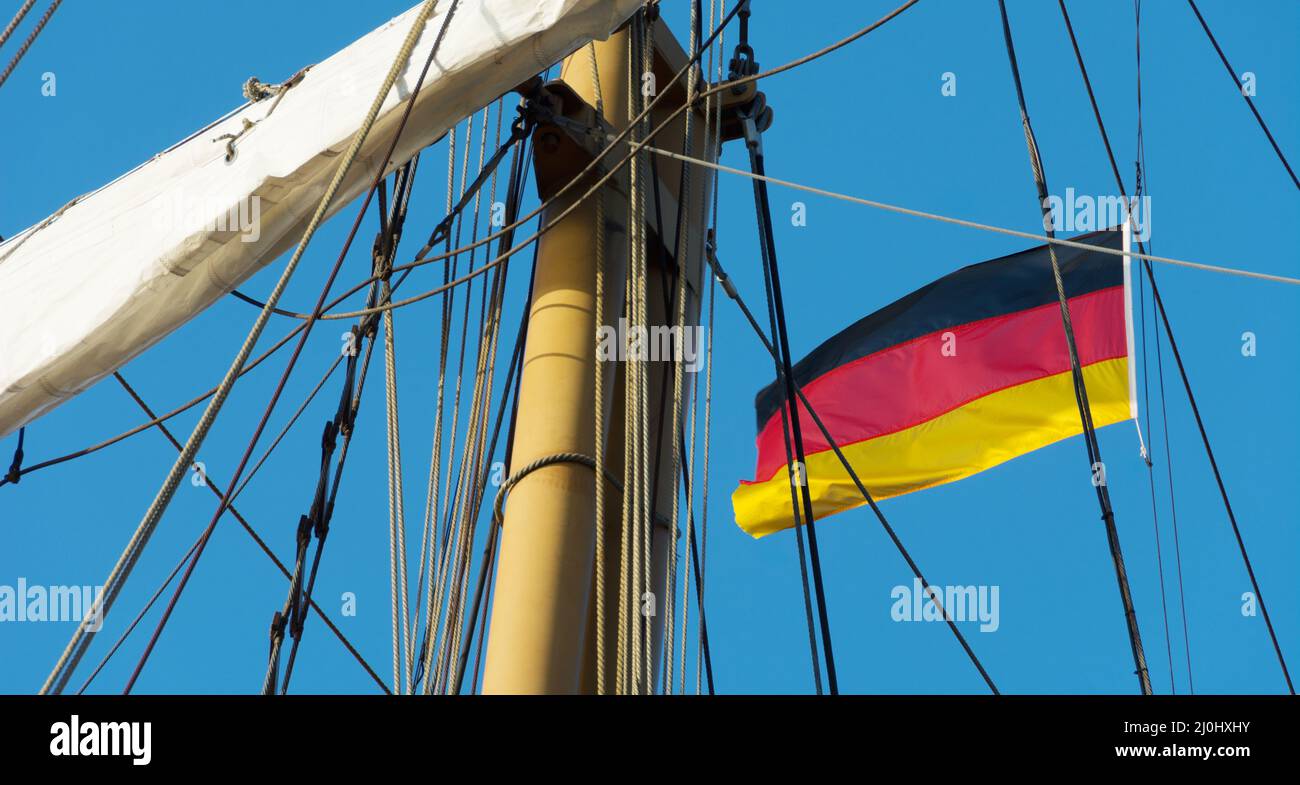 Sailing ship with waving Germany flag Stock Photo