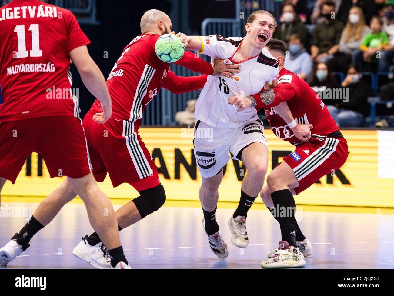 Gummersbach, Germany. 19th Mar, 2022. Handball: International match, Germany - Hungary, Schwalbe-Arena. Hungary's Adrian Sipos (2nd from left) and Csaba Leimeter (right) try to prevent Germany's Juri Knorr from throwing. Credit: Marius Becker/dpa/Alamy Live News Stock Photo