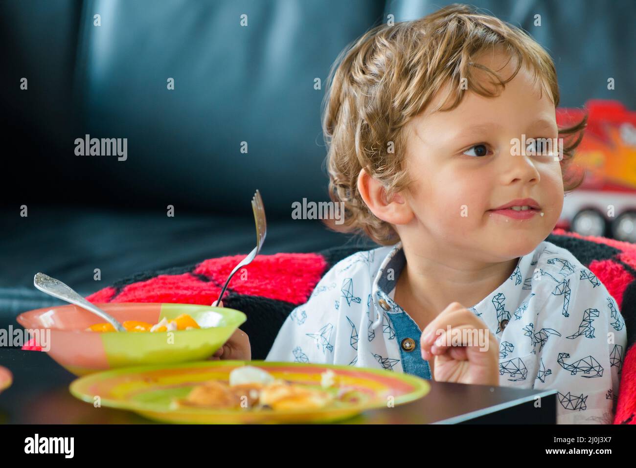 Baby food, babies eating. Kid boy eating healthy food Stock Photo Alamy