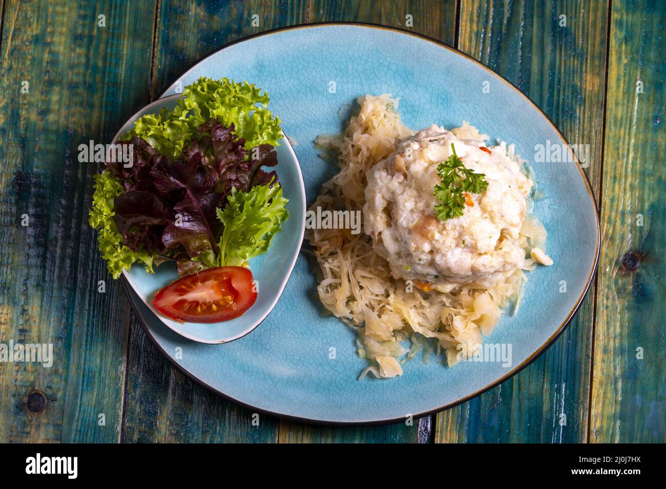 Austrian bread dumpling on sauerkraut Stock Photo