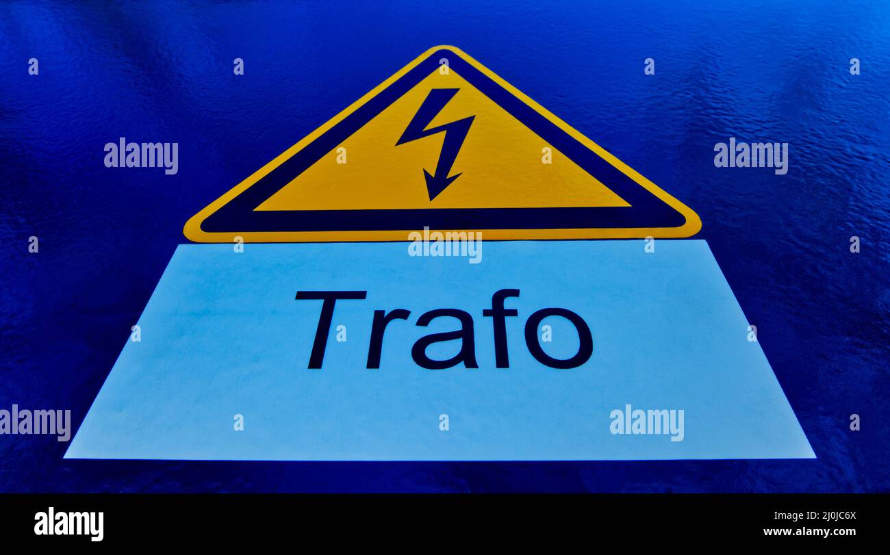 yellow sign of a high voltage transformer on deep blue ground with ...