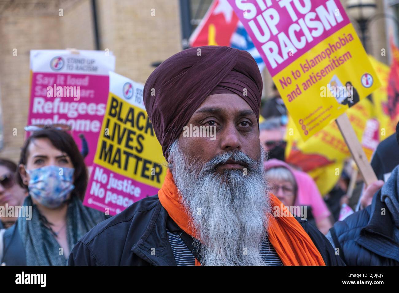 London, UK. 19th March 2022.One of a number of Sikhs on the march.  Several thousands from Stand Up To Racism, trade unionists, faith groups, politicians and other campaigns march from the BBC to a rally at Parliament Square under the slogan 'World Against Racism & Fascism', as part of a united day of action with Glasgow, Cardiff and cities around the world. The event opposed the Tory racist offensive of the Nationality and Borders Bill, Policing Bill and Higher Education Bill with these racist bills attacking refugees and migrants, Gypsy Roma and Traveller communities, and supported the #Blac Stock Photo