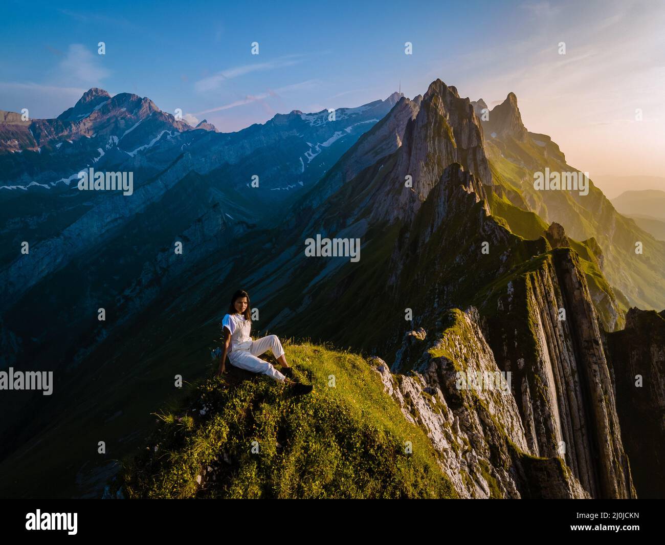 Woman hiking in the mountains, Schaefler Altenalptuerme mountain ridge ...