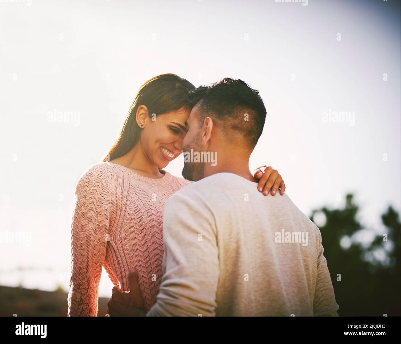 With every passing day I love you more and more. Shot of a happy young couple spending time together outdoors. Stock Photo