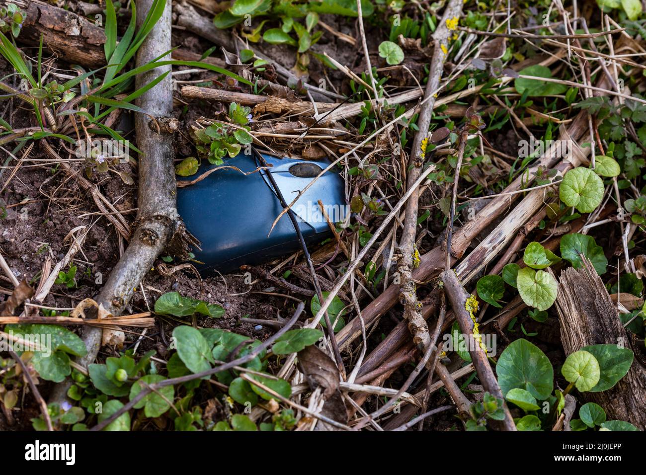 A computer mouse harms, pollutes and poisons the environment in Germany Stock Photo