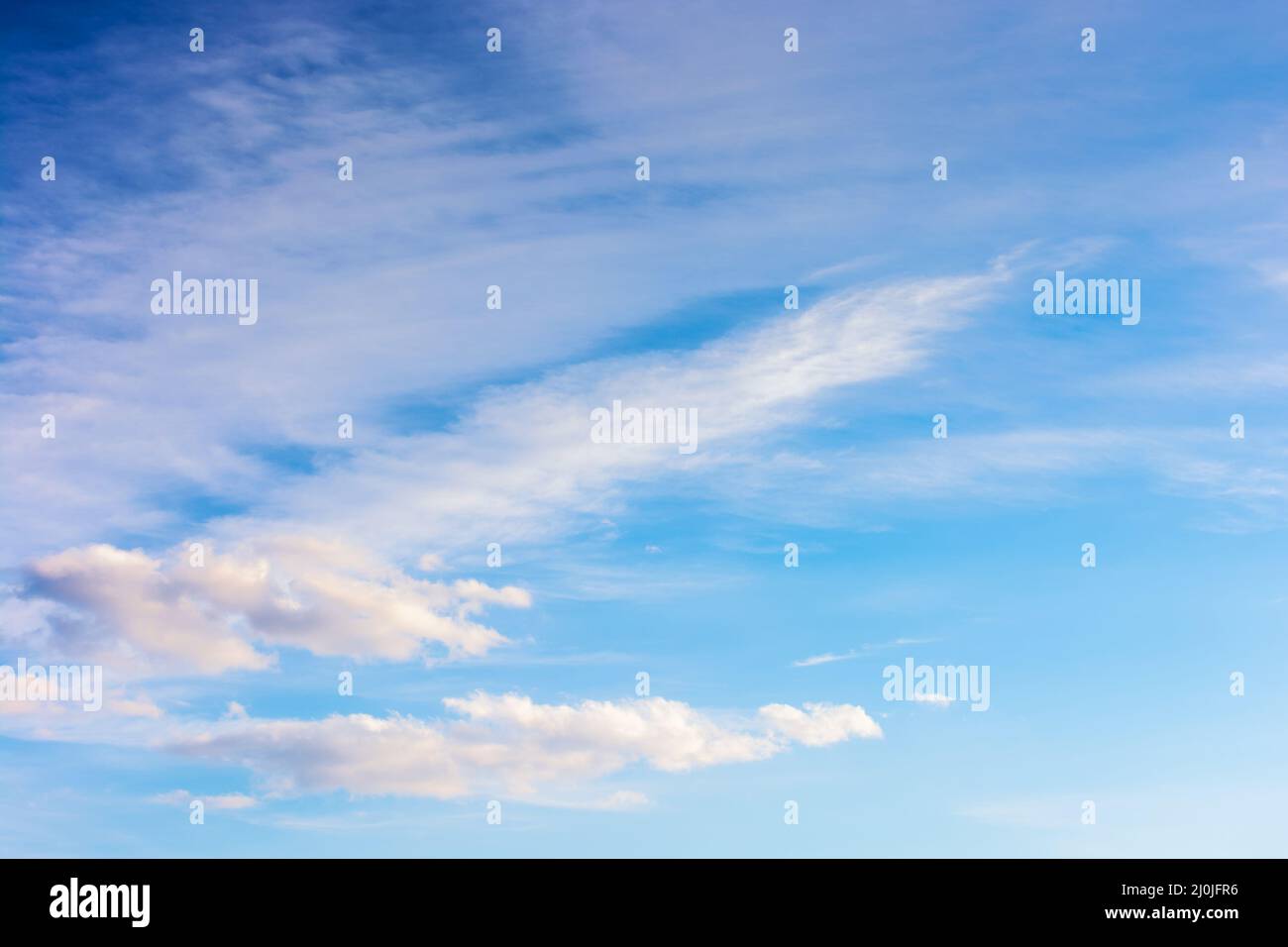 blue sky and white clouds on a windy weather. atmosphere air freedom concept. nature series in spring. creative gradient background for installation a Stock Photo
