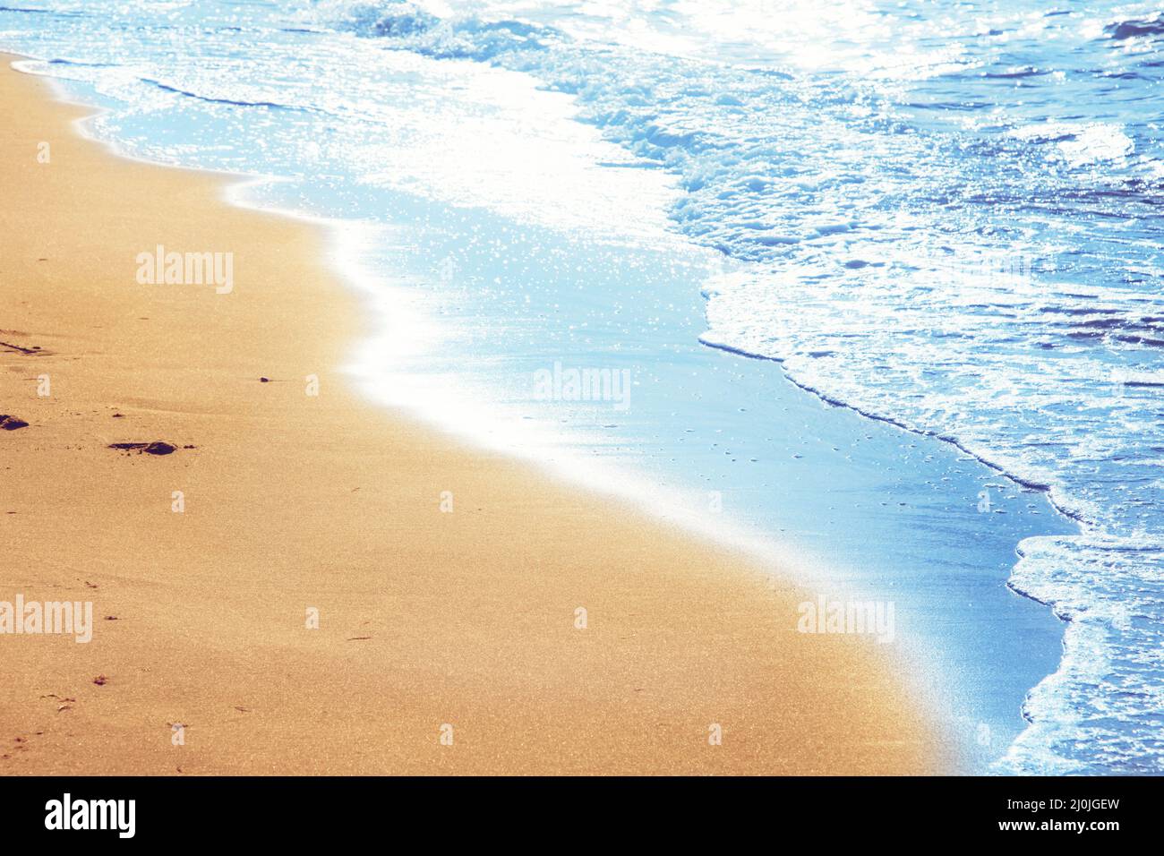Walking on the beach, leaving footprints in the sand Stock Photo - Alamy