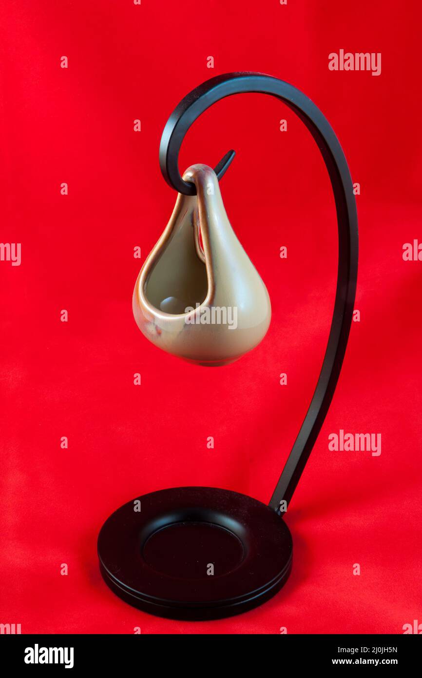 Aromatherapy Oil Container against a red background Stock Photo Alamy