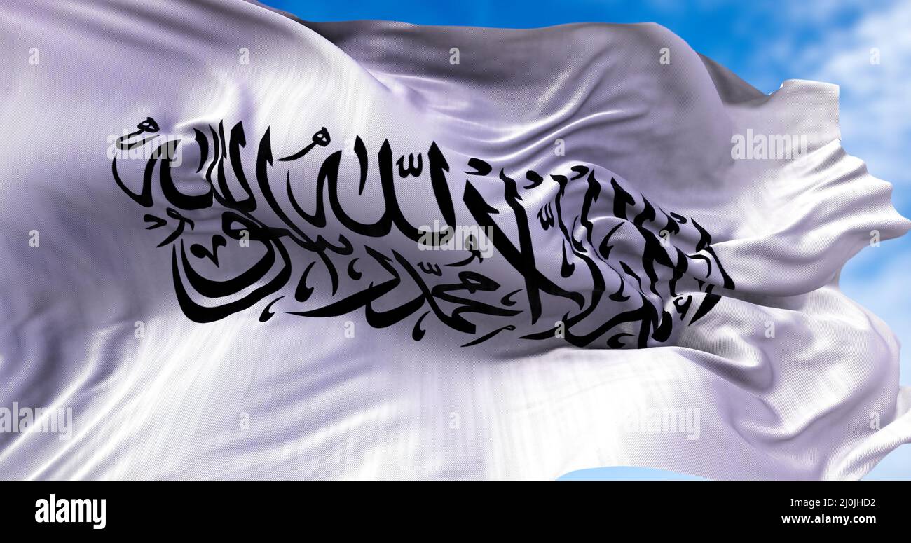 The flag of the Islamic Emirate of Afghanistan waving in the wind. Stock Photo