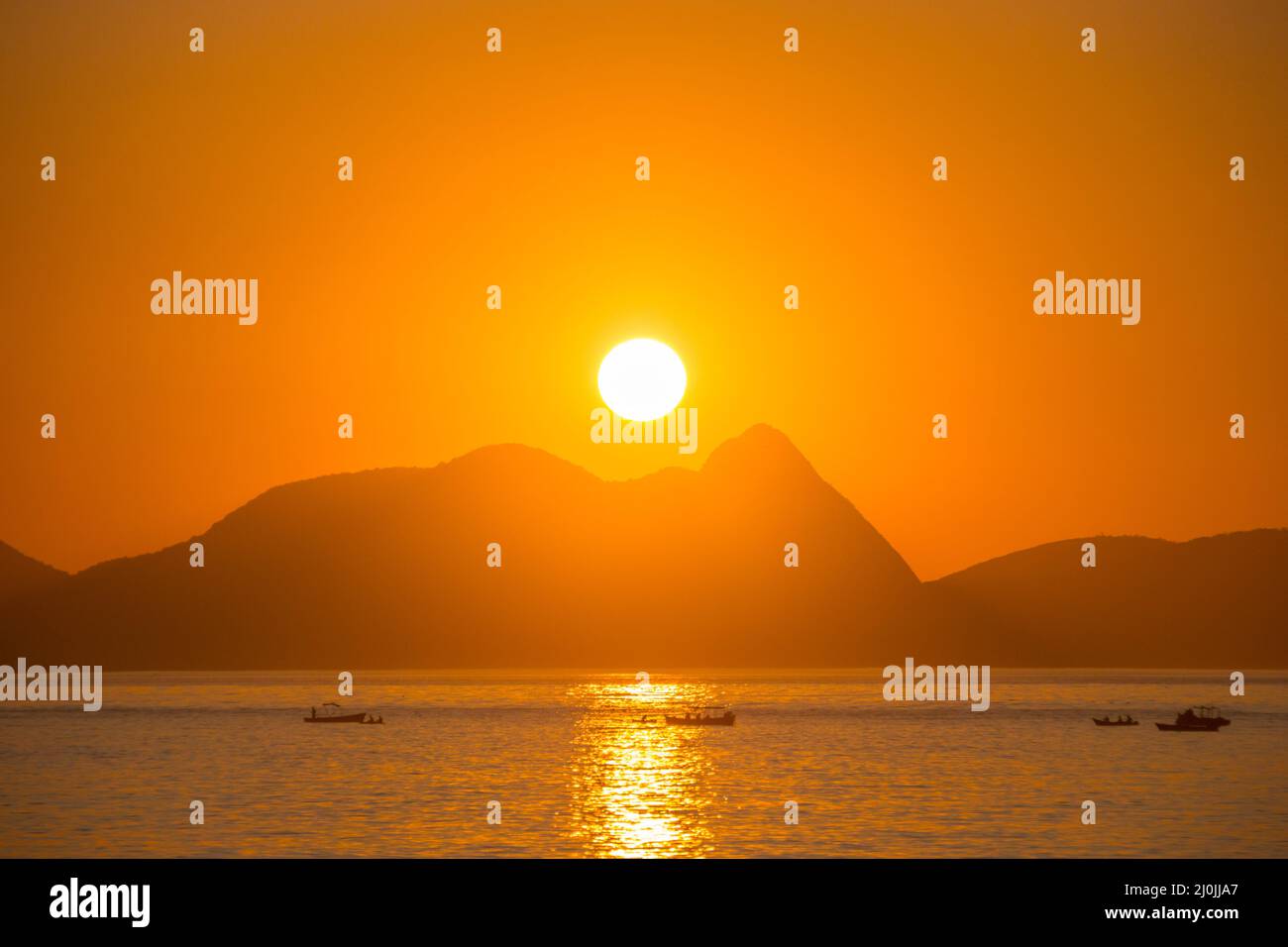 Dawn on the red beach in Rio de Janeiro, Brazil. Stock Photo
