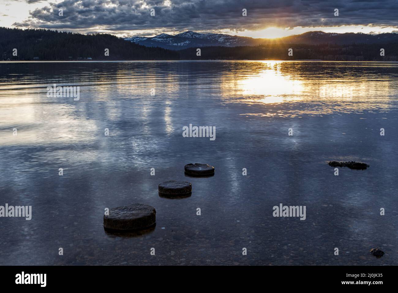 Three round objects in the water Stock Photo Alamy