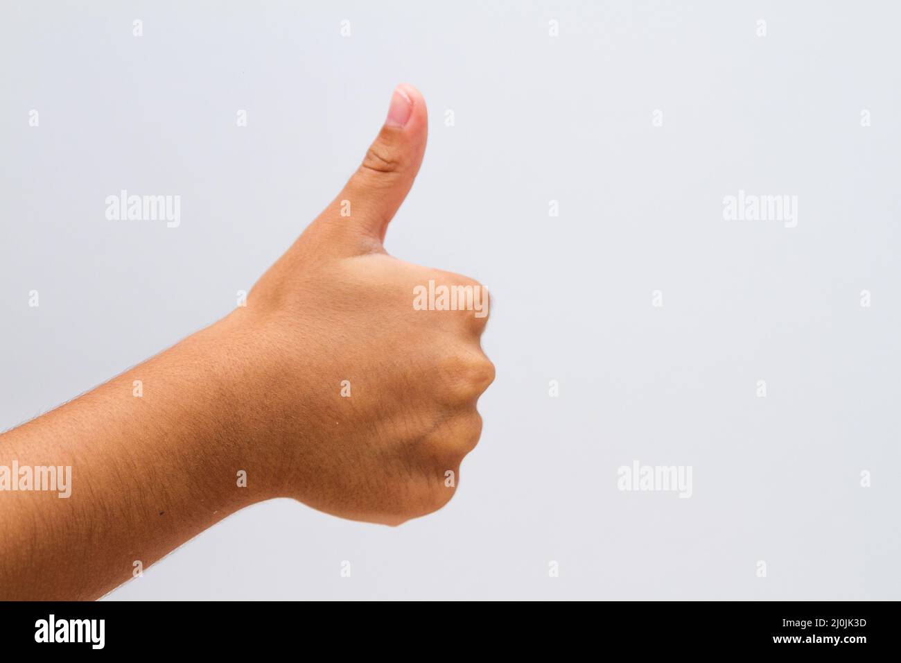 child making a like sign on a white background in Rio de Janeiro Stock ...