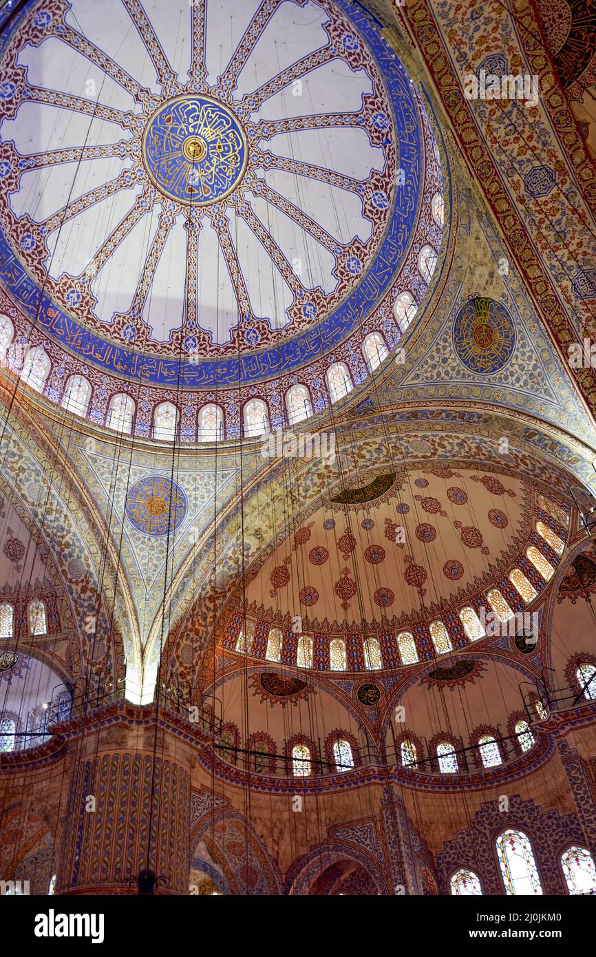Ceiling and interior of the Blue Mosque in Istanbul with its colorful mosaics Stock Photo