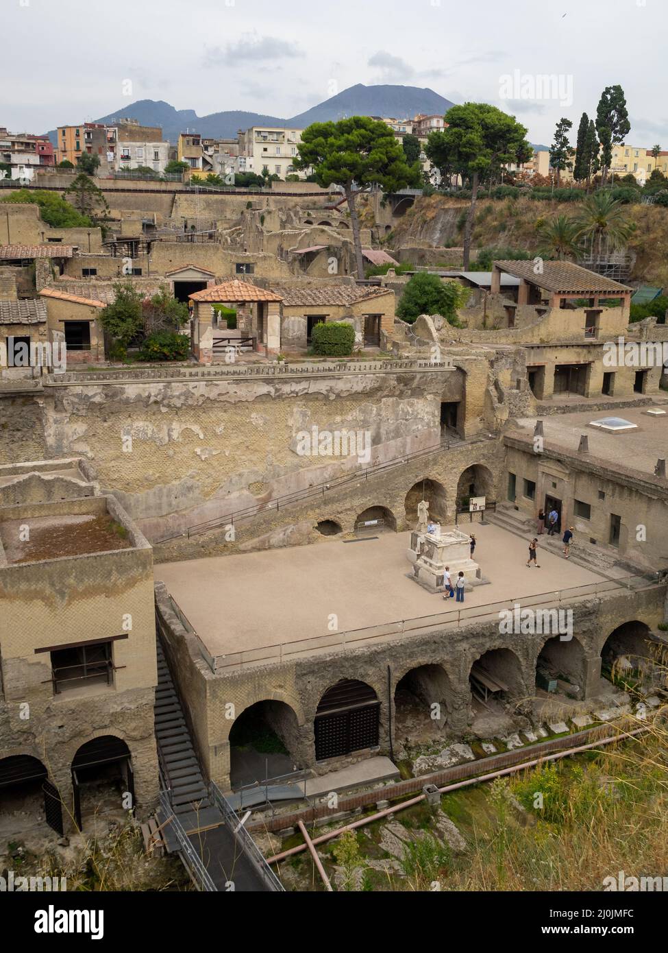 View of Herculaneum ruins between the modern city, with Mount Vesuvio in background Stock Photo