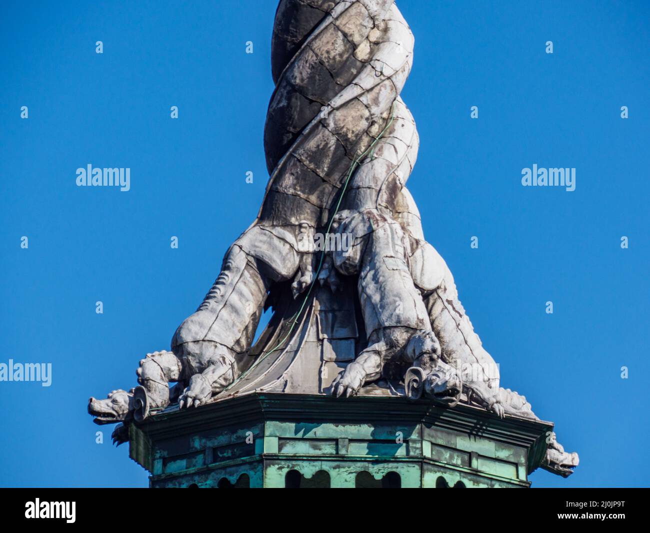 Copenhagen, Denmark - July, 2021: Spire, shaped as the tails of four dragons twined together, reaching a height of 56 metres on the Børsen -17th-centu Stock Photo