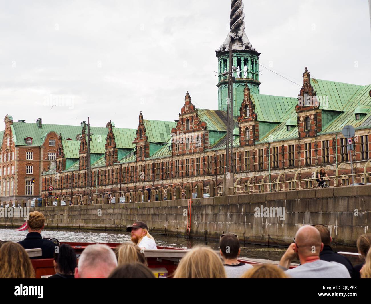 Copenhagen, Denmark - July, 2021: Børsen also known as Børsbygningen is a 17th-century stock exchange historic building in the center. Tourists in the Stock Photo