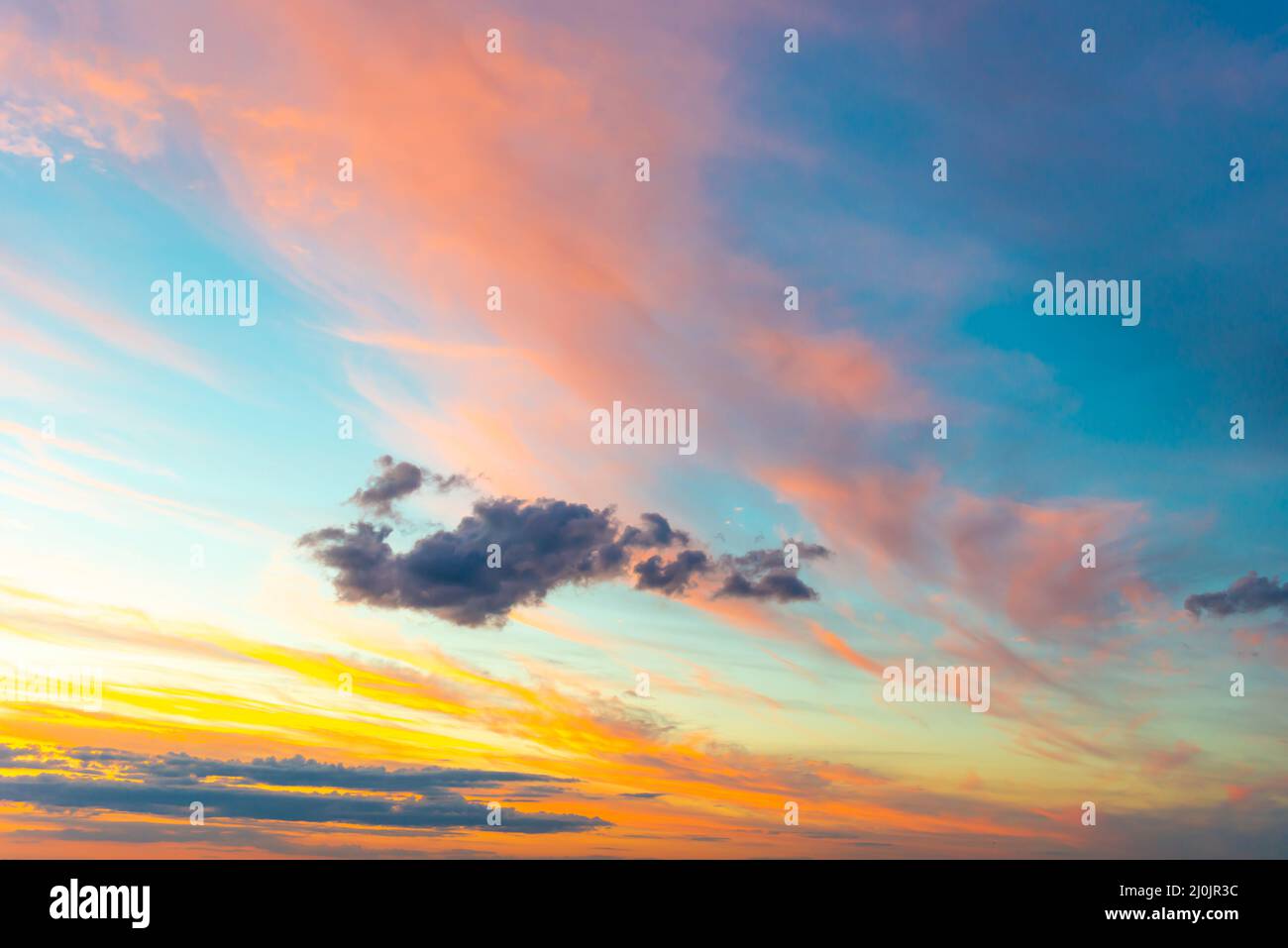 Sunset sky with sunset clouds Stock Photo