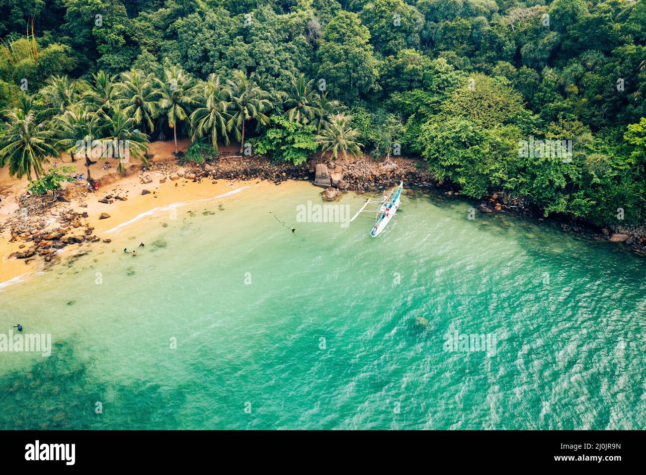 Tropical Jungle Coast in Sri Lanka. Aerial view of Exotic Costline, Beach and Rainforest. Paradise Beach. Stock Photo