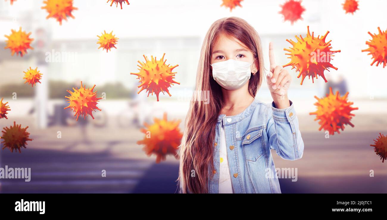 Young girl with protection mask against corona virus at school. Stock Photo