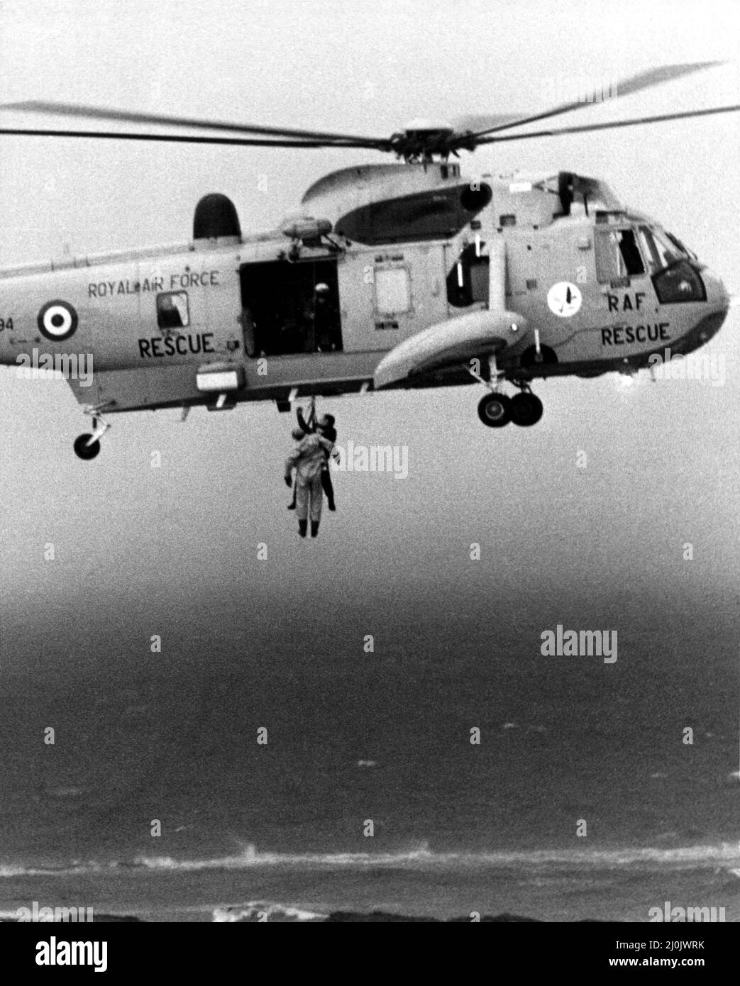A RAF search and rescue Sea King from RAF Boulmer winches a man onboard ...
