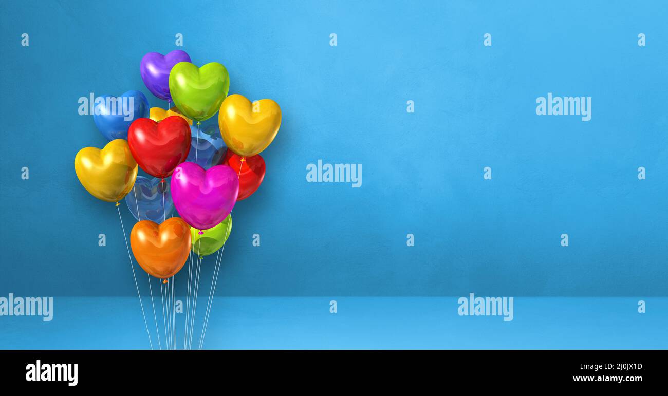 Colorful heart shape balloons bunch on a blue wall background ...