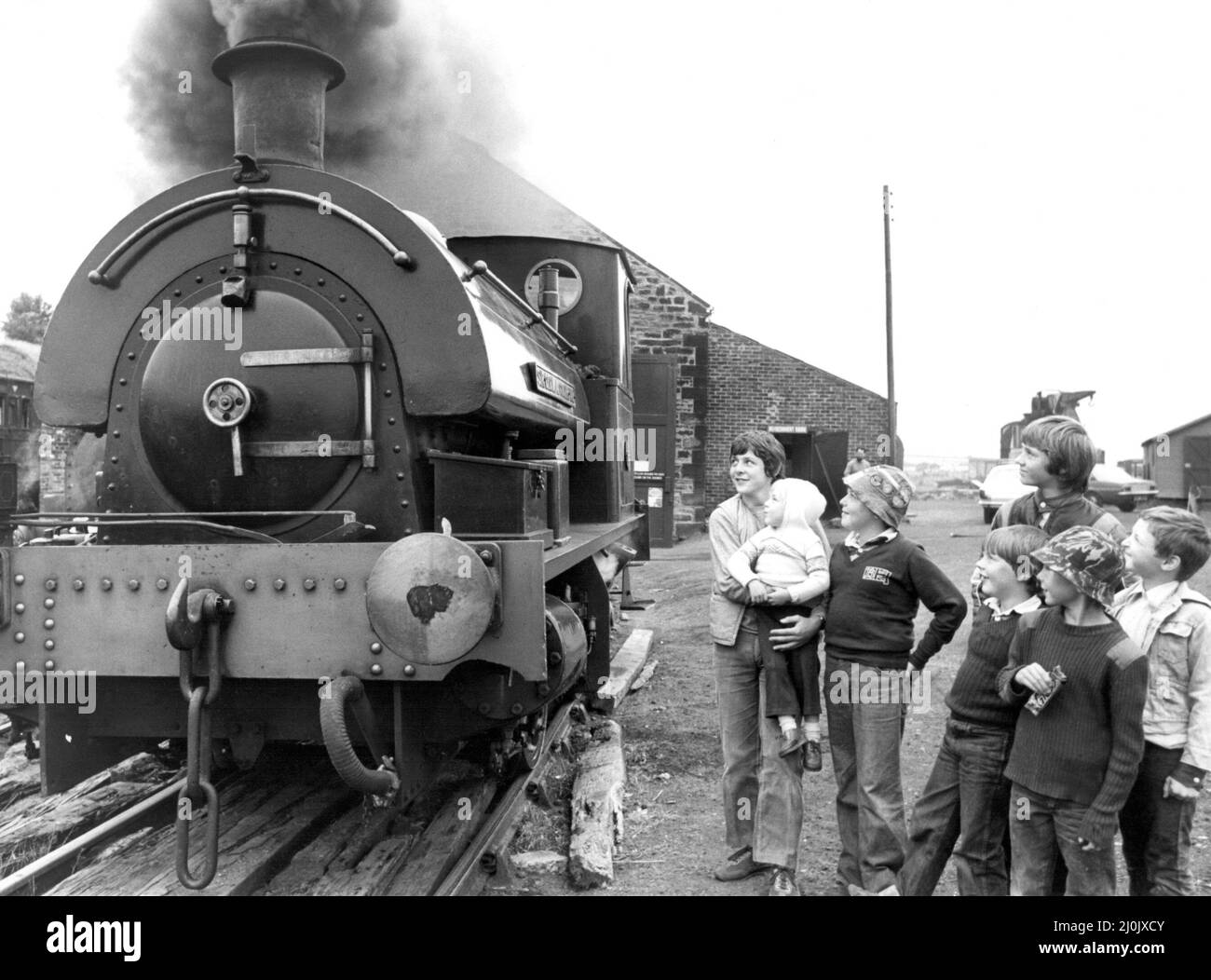 Youngsters enjoying the last few days of their holidays find the old steam trains at Tanfield Railway an attraction on 31st August 1981 Stock Photo