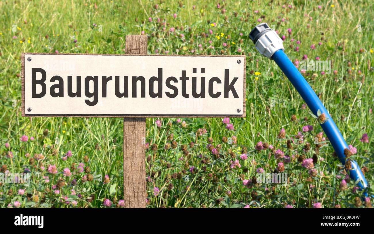 Sign with the German word BaugrundstÃ¼ck (building plot) Stock Photo