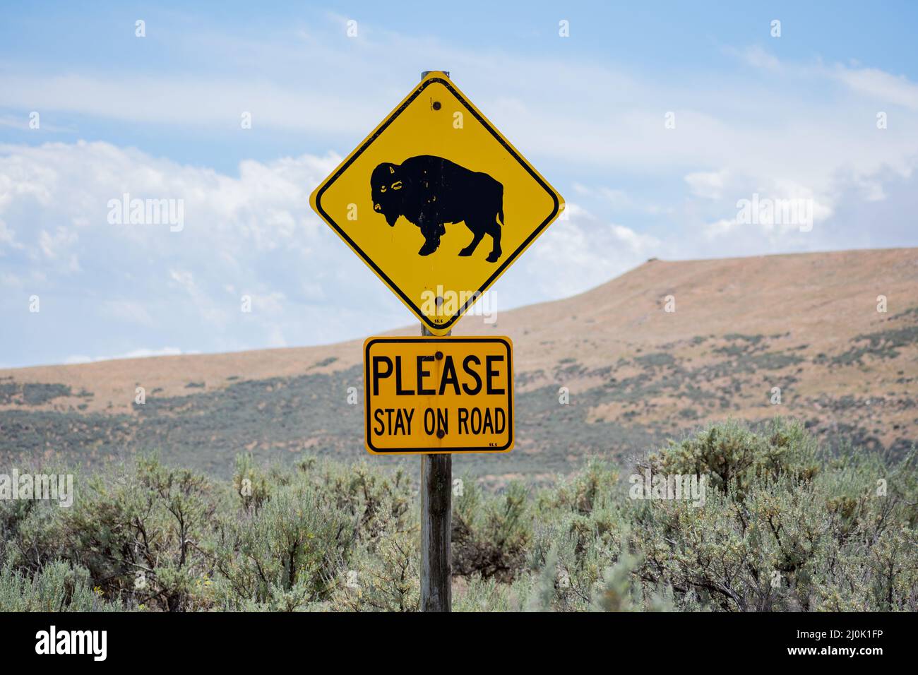 A caution signboard for hikers in Antelope Island SP, Utah Stock Photo